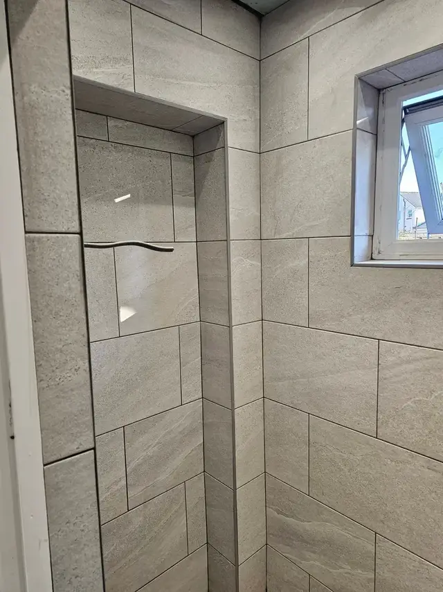 Bathroom tiling in Swansea: grey brick