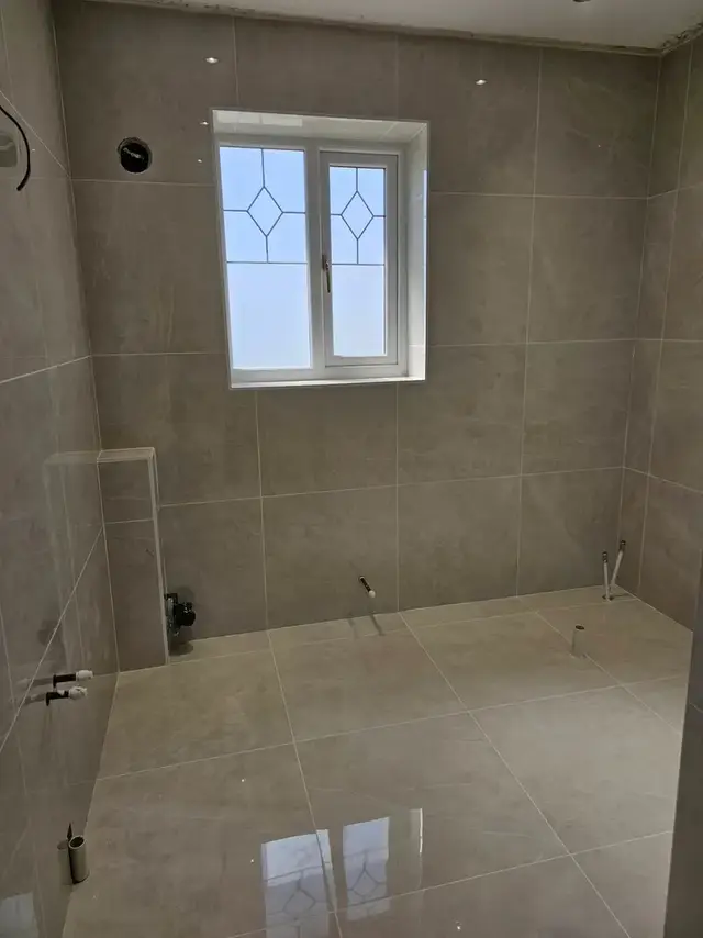 Bathroom tiling in Swansea: grey 600x600 tiles