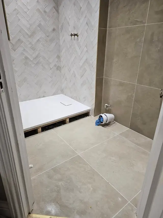 Bathroom tiling in Swansea: herringbone plus floor