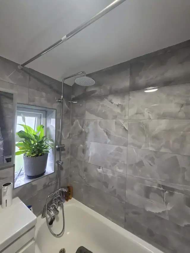 Bathroom tiling in Swansea: grey brick