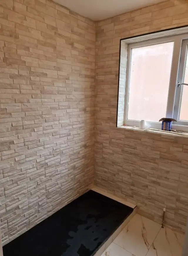Bathroom tiling in Swansea: brick natural stone tile