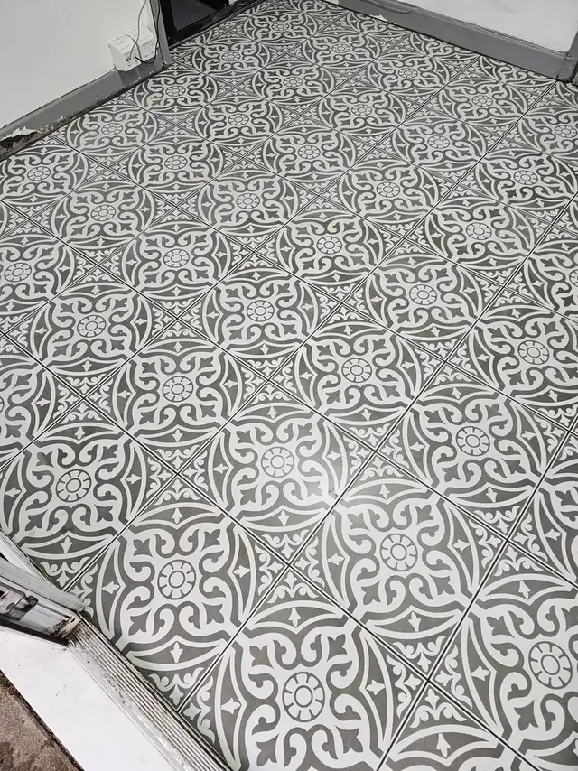 Black and white patterned floor tiles