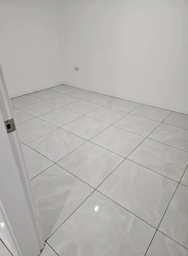 Floor tiling in Swansea: white floor tiles