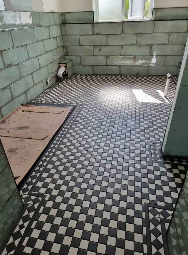Floor tiling in Swansea: black and white mosaic pattern