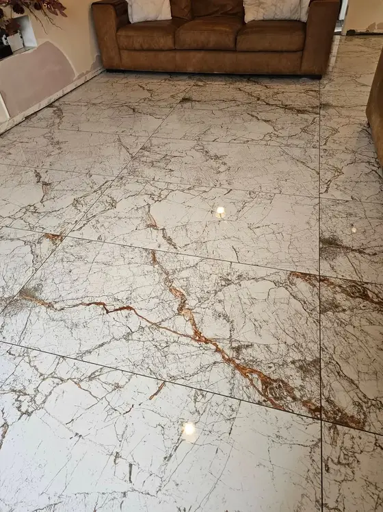 After: marble-effect floor tiles laid in a living room by Chris Tiling Specialist