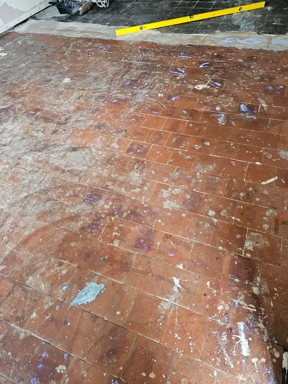 Before: old floor stripped back ready for tiling